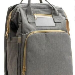 Diaper bag backpack with changing station built in